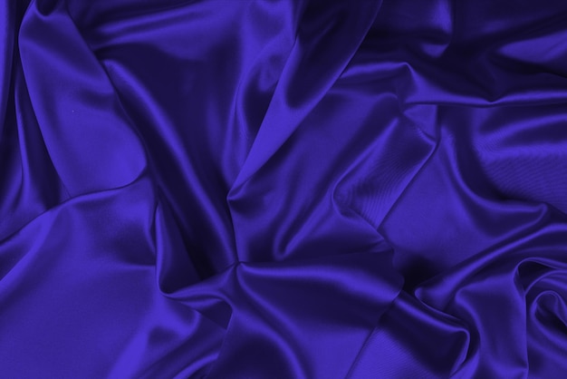 Purple silk or satin luxury fabric texture can use as abstract background Top view