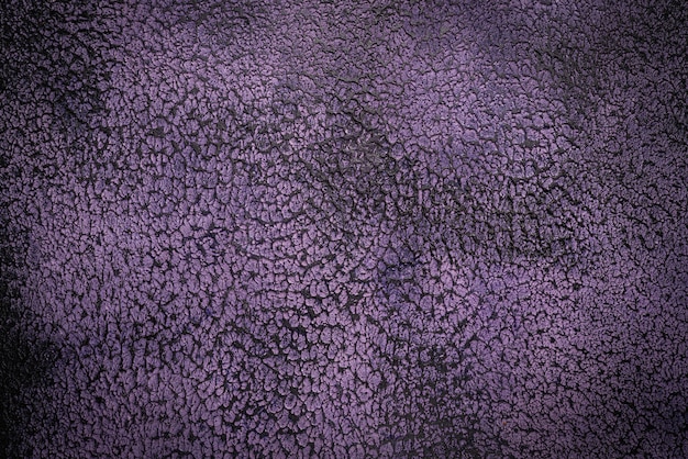 Purple stone or concrete wall background, top view texture