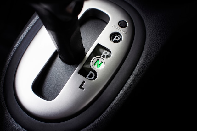 Put a gear stick into N position, (Neutral) Symbol in auto transmission car.