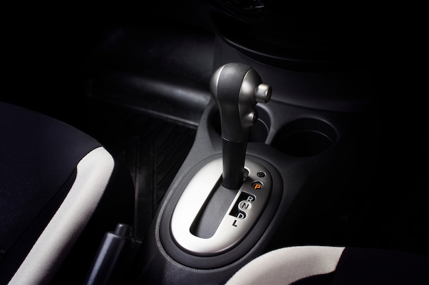 Put a gear stick into P position, (Parking) Symbol in auto transmission car.