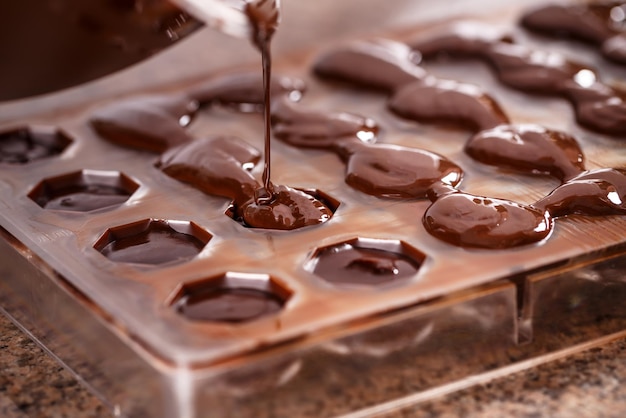 Putting chocolate in mold