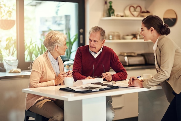 Putting something aside for retirement is an unavoidable necessity Shot of a senior couple getting advice from their financial consultant