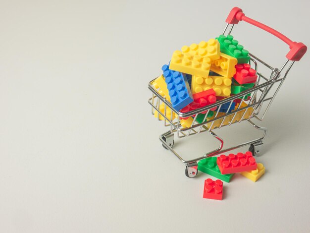 The puzzle plastic box in supermarket cart for kid or education concept