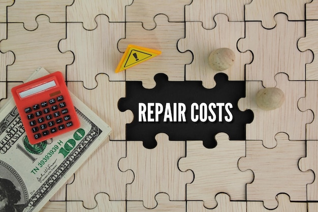 A puzzle with a calculator on it that says repair costs.