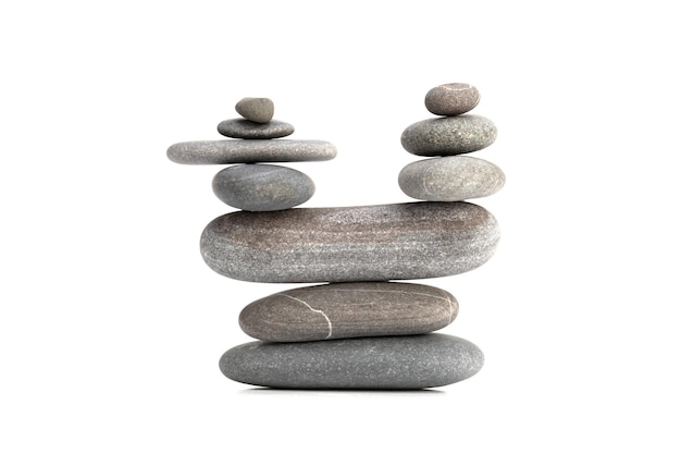 Pyramid of the balanced grey stones isolated on white background