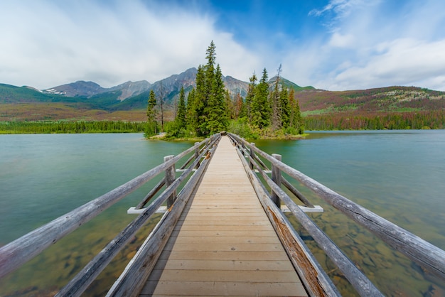 The Pyramid island in spring with color changing background in Alberta, Canada