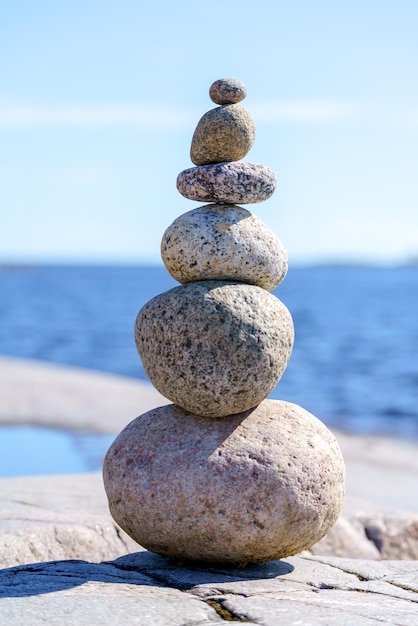 Pyramid of stones Unstable balance of stone objects Idyllic state of nature