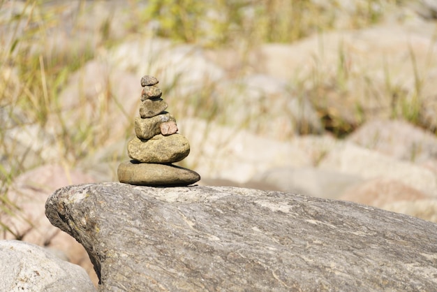 Pyramid of stones Unstable balance of stone objects Idyllic state of nature