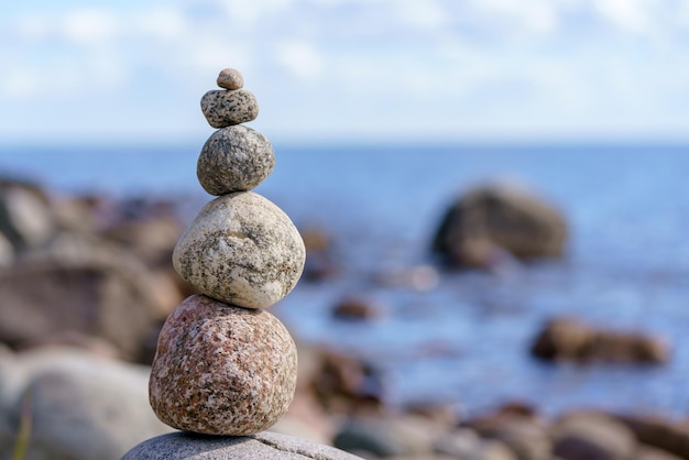 Pyramid of stones Unstable balance of stone objects Idyllic state of nature