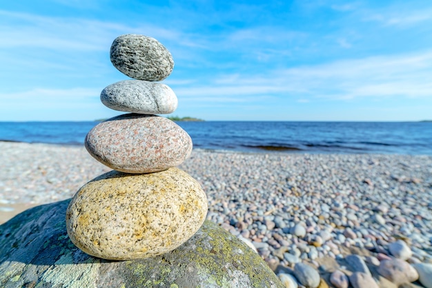 Pyramid of stones Unstable balance of stone objects Idyllic state of nature