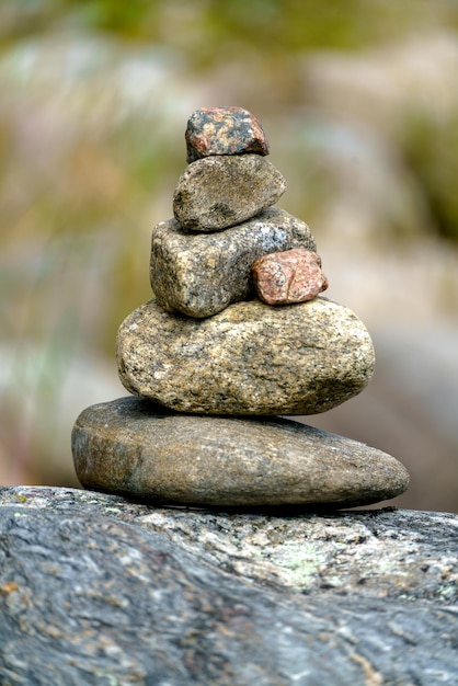 Pyramid of stones Unstable balance of stone objects Idyllic state of nature