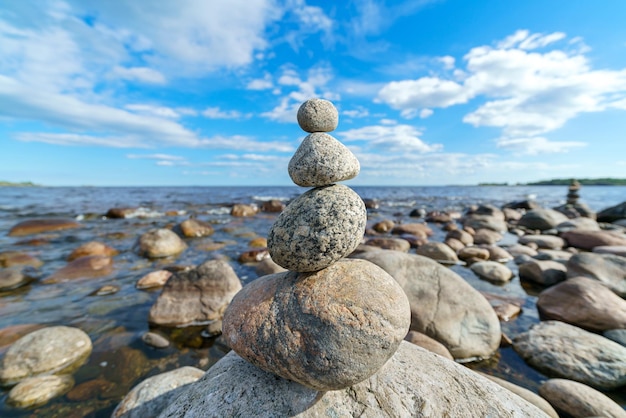 Pyramid of stones Unstable balance of stone objects Idyllic state of nature