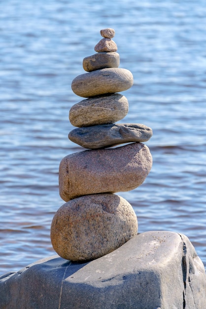 Pyramid of stones Unstable balance of stone objects Idyllic state of nature