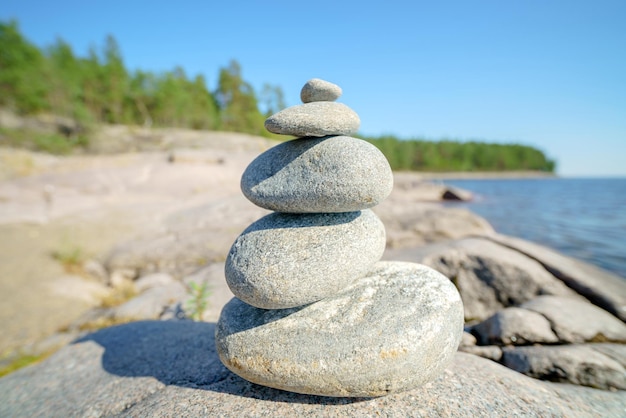 Pyramid of stones Unstable balance of stone objects Idyllic state of nature