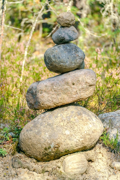 Pyramid of stones Unstable balance of stone objects Idyllic state of nature