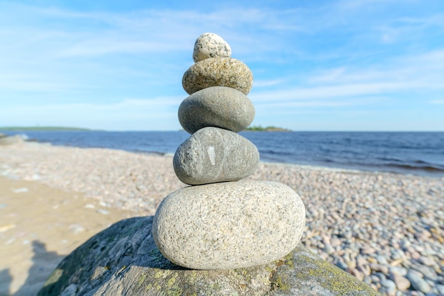 Pyramid of stones Unstable balance of stone objects Idyllic state of nature