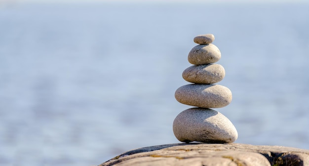 Pyramid of stones Unstable balance of stone objects Idyllic state of nature