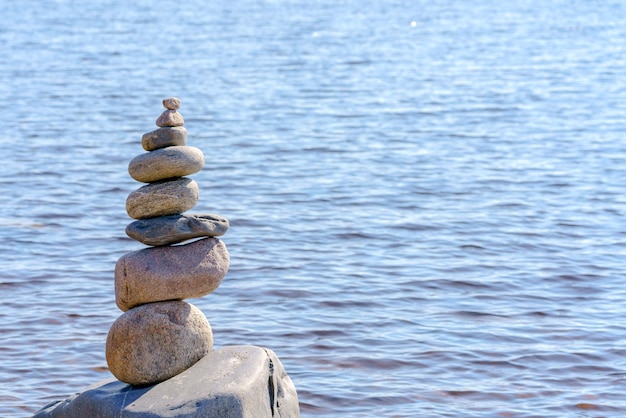 Pyramid of stones Unstable balance of stone objects Idyllic state of nature