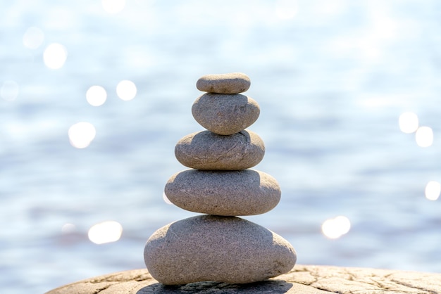 Pyramid of stones Unstable balance of stone objects Idyllic state of nature