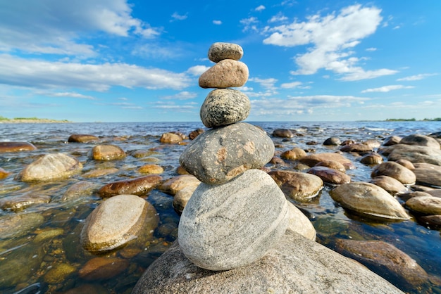 Pyramid of stones Unstable balance of stone objects Idyllic state of nature