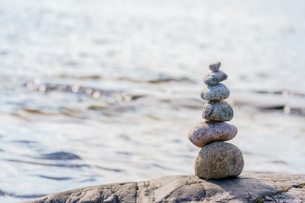 Pyramid of stones Unstable balance of stone objects Idyllic state of nature