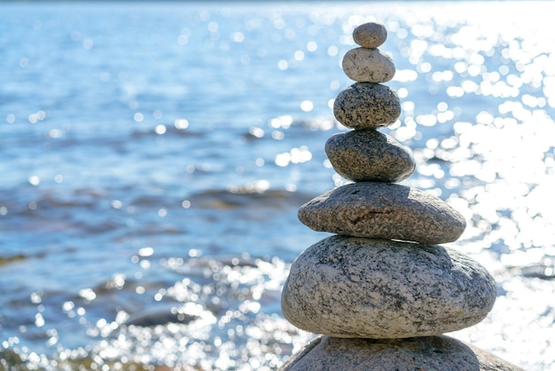 Pyramid of stones Unstable balance of stone objects Idyllic state of nature