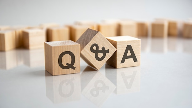 Q and A - question and answer shot form on wooden block