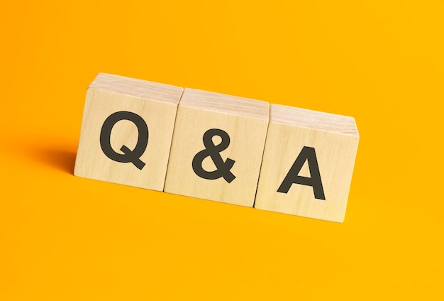 Q and A, questions and answers on wooden cubes. Concept