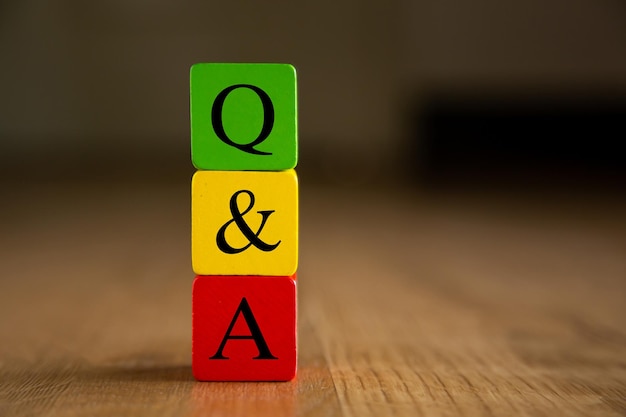 QA word on wooden blocks