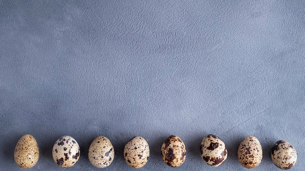 Quail eggs background with copy space Top view