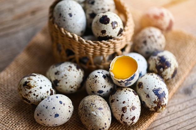 Quail eggs on basket fresh quail eggs on wooden table background raw eggs with peel egg shell