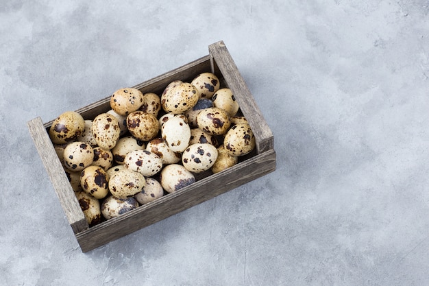 Quail eggs in a wooden box