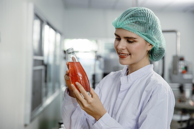 Quality control and food safety inspector test and check product contaminate standard in the food and drink factory production line with hygiene care