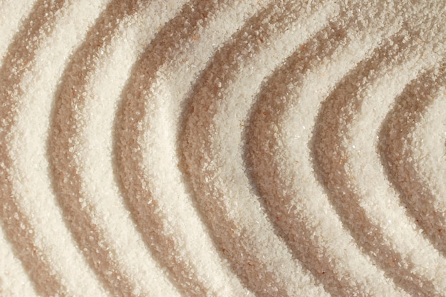 Quartz sand.Round waves on sand.