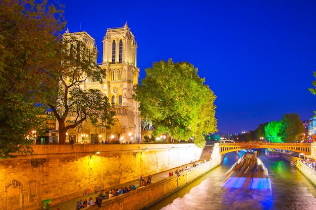 Quay of Seine and Notre Dame de Paris at night, France