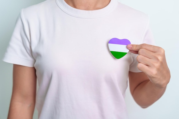 Queer Pride Day and LGBT pride month concept purple white and green heart shape for Lesbian Gay Bisexual Transgender genderqueer and Pansexual community