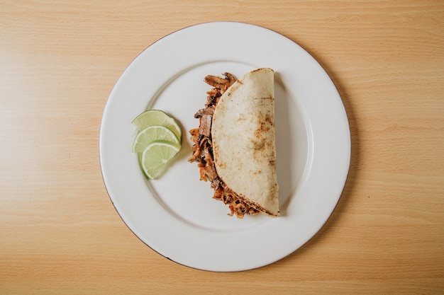 quesadilla on white plate, top view