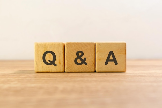 Photo question and answer or q and a written on wooden blocks