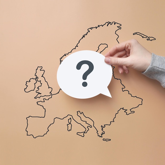 A question mark on the background of a map of Europe