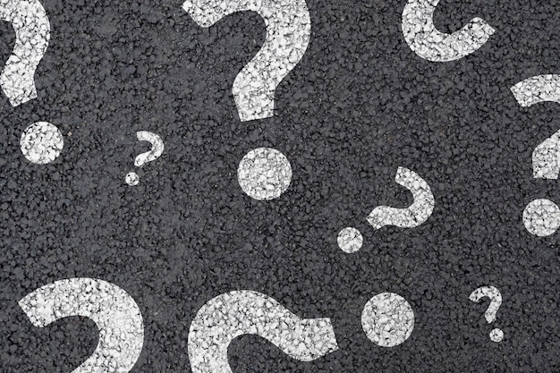 Question mark concept or FAQ Street asphalt sign