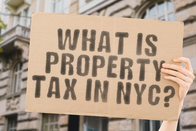 The question What is property tax in NYC on a banner in mens hand Taxed Paid USA New York