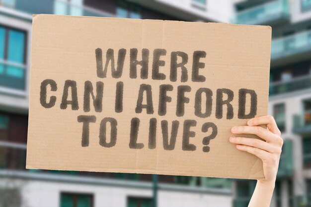 The question Where can i afford to live on a banner in mens hand Living House Home