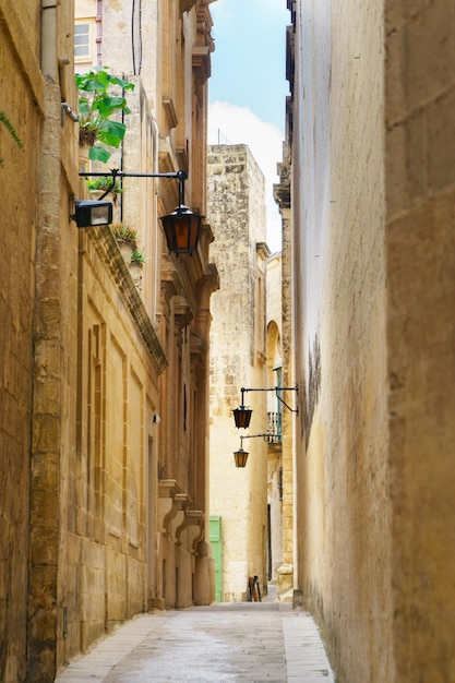 Quiet narrow desert medieval street in silent city Mdina Malta Travel postcard vacation concept