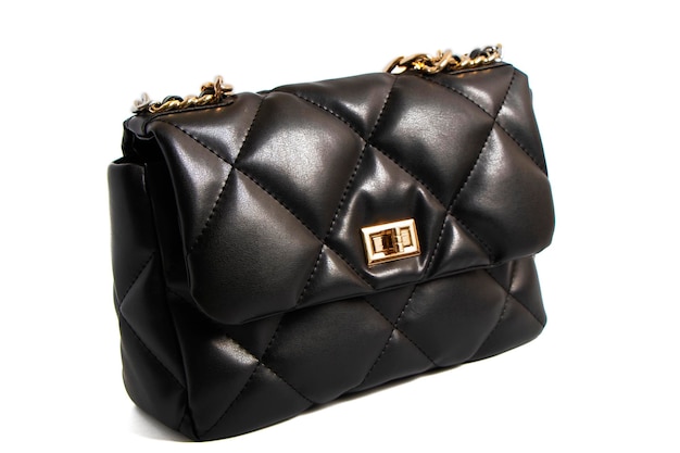 quilted leather bag in black. Women's fashionable clutch isolate on a white background. trends 2022