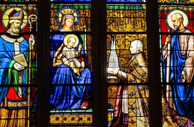 Quimper Brittany France  August 11 2017  Stained glass in the Cathedral of Saint Corentin Bishop his grace Graveran offering cathedral to Our Lady and St Corentin