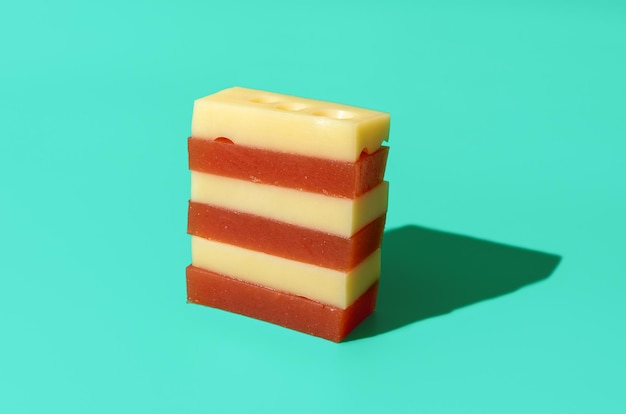 Quince marmalade and cheese isolated on a blue background