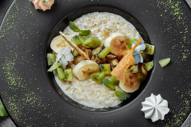 Quinoa porridge with banana blueberry and pecan nuts for breakfast