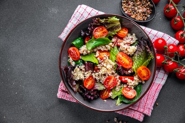 quinoa salad tomato green lettuce mix healthy meal food snack on the table copy space food