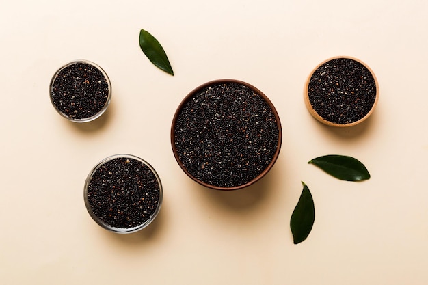 Quinoa seeds in bowl on colored background Healthy kinwa in small bowl Healthy superfood