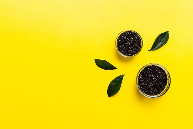 Quinoa seeds in bowl on colored background Healthy kinwa in small bowl Healthy superfood